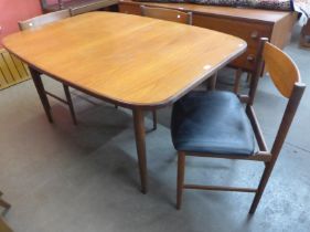 A teak extending dining table and three chairs
