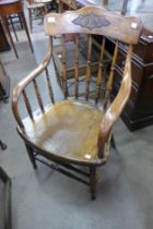 An early 20th Century American elm elbow chair