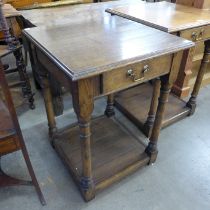 A George III style oak single drawer lamp table