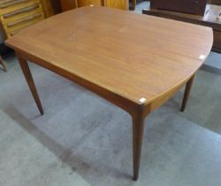 A Greaves & Thomas teak extending dining table