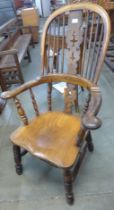 A 19th Century elm and yew wood highback Windsor chair