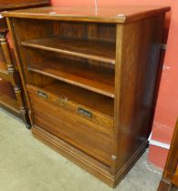 An early 20th Century oak tambour front fitted cabinet