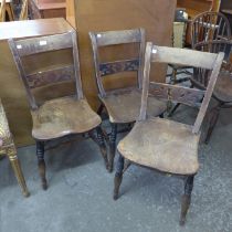 A set of three George IIII elm and beech Windsor kitchen chairs