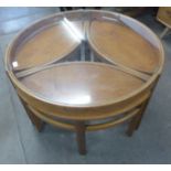 A Nathan Trinity teak and glass topped circular nest of tables