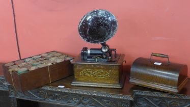 An oak cased Edison Standard Phonograph, with metal speaker horn and various wax cylinders