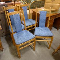 A set of four Ercol elm and beech chairs