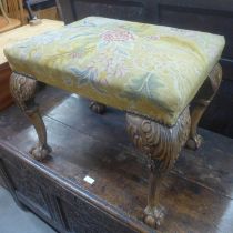 A George I style carved walnut and embroidered stool