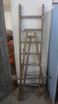 A pine artist's easel and a ladder