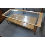 A teak and glass topped rectangular coffee table