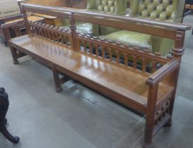 A Victorian Gothic Revival carved oak hall bench