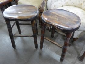 A pair of Victorian style beech kitchen stools