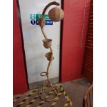 A bamboo snake shaped floor standing lamp/plant stand