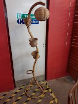 A bamboo snake shaped floor standing lamp/plant stand