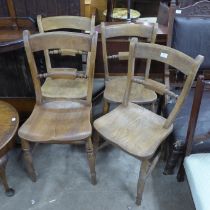 A set of four Victorian elm and beech kitchen chairs