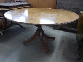 A Regency mahogany oval tilt-top centre table