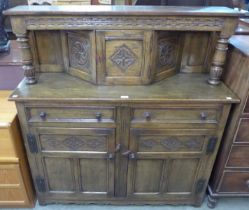 A 17th Century style carved oak court cupboard