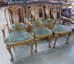 A set of six Queen Anne style walnut dining chairs