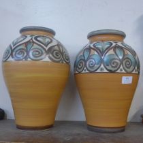 A pair of similar Langley glazed pottery vases