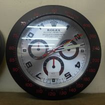 A Rolex style dealer's display wall clock