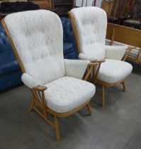 A pair of Ercol Blonde beech Evergreen armchairs