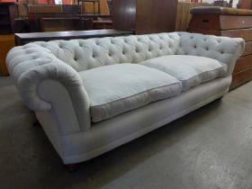 A Victorian style fabric upholstered Chesterfield settee