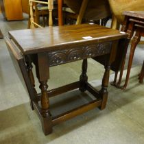 A small oak drop-leaf occasional table