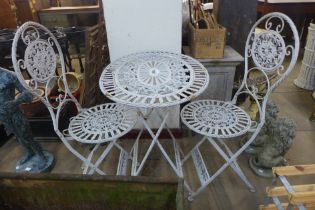 A French style metal folding garden table and two chairs