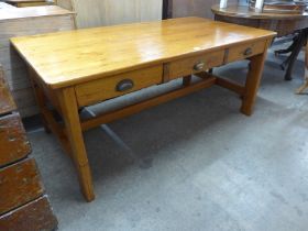 An early 20th Century waxed pine six drawer double sided library table