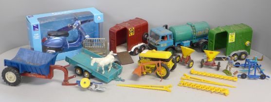 A box of Britain's farm toys and a Vespa model scooter