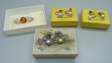 A silver and amber set brooch, and three pairs of faux pearl screw back earrings with silver mounts