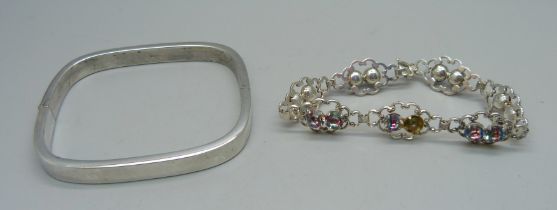 A silver bangle and a paste stone set bracelet, some stones a/f, 29g