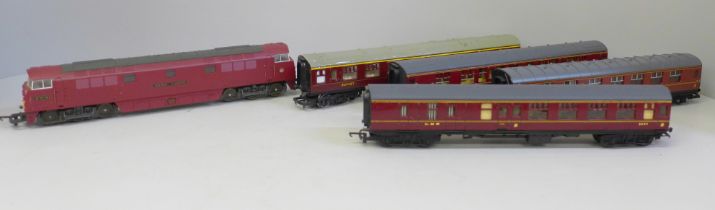 An OO gauge Lima diesel Western Gladiator and four LMS maroon coaches