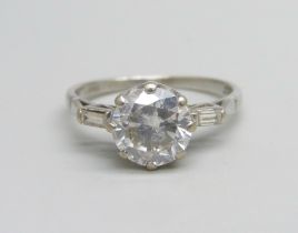 An 18ct white gold and diamond Art Deco style ring, 1.5ct centre stone with baguette diamond