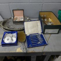 A box of silver plate and pewter including two trays, salver, cased forks, wine coaster, etc., and a