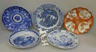 Four Chinese export blue and white plates, a Kutani plate and four white china models of horses