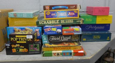 A collection of vintage and modern board games, including Scrabble De Luxe, Buccaneer, Careers, some