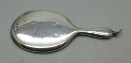 A doll's miniature silver mirror, 7cm, Birmingham 1938