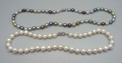 Two pearl necklaces, both with silver clasps, white pearls approximately 40cm and other string 45cm