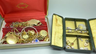 Two boxes containing silver rings, charms and costume jewellery