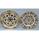 Two Royal Crown Derby 1128 plates, one with wavy edge, 22cm and 23cm