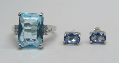 A silver ring set with a paste blue stone and small white stones, Q, and a pair of silver and blue