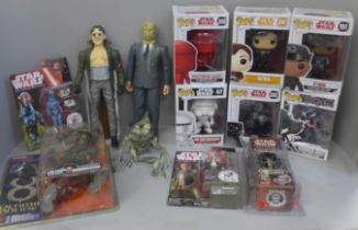 A collection of Star Wars Action figures, pop figures, etc.