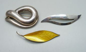 A David Andersen silver and enamel brooch, a large Spanish silver brooch and another Danish silver