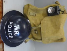 A WR (War Reserve) Police WWII helmet, gas mask bag, lamp, whistle and rucksack