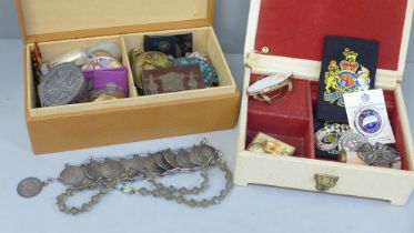 Two boxes of trinket boxes, badges, jewellery, etc.
