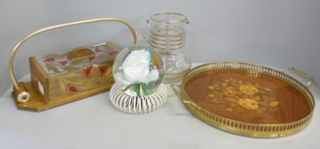 A French biscuit box, an inlaid tray decorated with flowers, Sorrento ware, and a glass jug