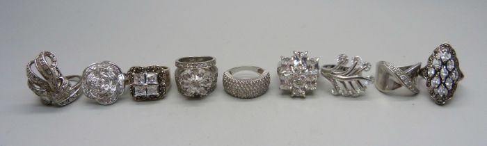 Nine chunky large silver rings set with cubic zirconia, quartz and marcasite, up to 30mm, 82g