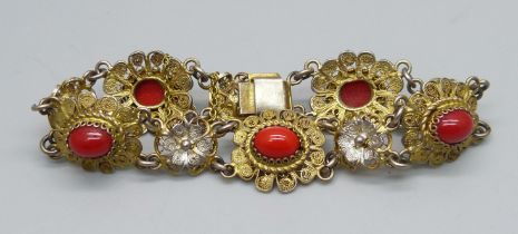 An .800 silver gilt bracelet set with coral, 15.5g,