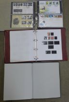 A collection of first day covers in album, an empty stamp album and an album containing British