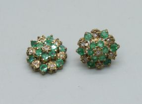 A pair of 9ct gold, diamond and emerald cluster stud earrings, 2.1g, one post requires repair